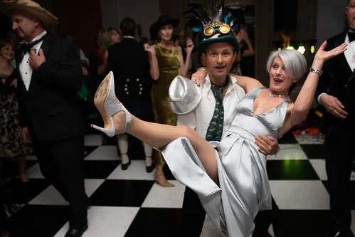 Band member in silver performing